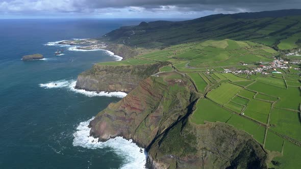 Drone Flying Over Steep Coast and Green Fields of San Miguel Island, Azores, Portugal