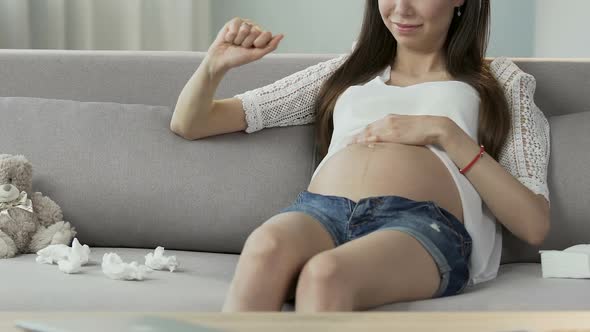 Mother-To-Be Crying, Sweeping Tissues From Sofa With Hand, Hysteria, Hormones