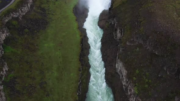 Gullfoss waterfalls in Iceland with drone video in canyon above,