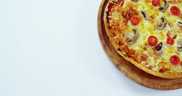 Baked pizza on wooden board