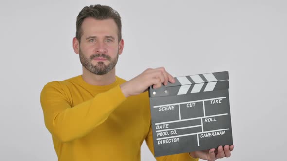 Portrait of Middle Aged Man Using Clapperboard for Shooting