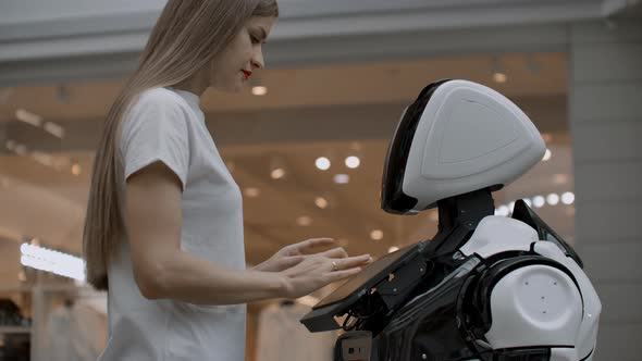 A Female Programmer Tests the Robot for the Ability to Interact with Users