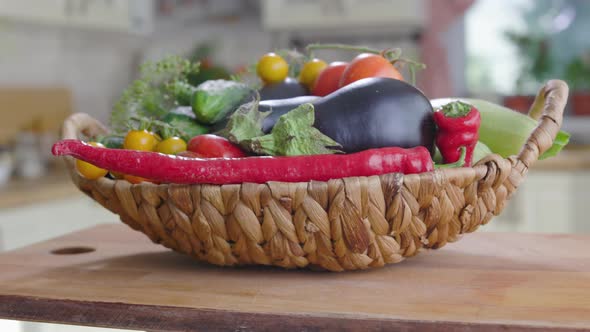 Basket Of Vegetables Is On the Table In Kitchen