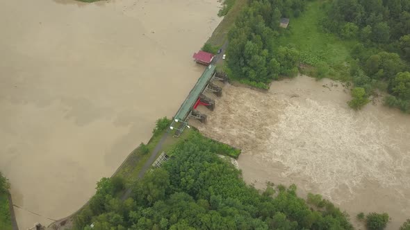 Aerial View of the Dam During Floods. Extremely High Water Level in the River.