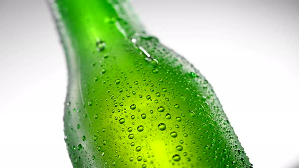 Cold Beer Bottle with Drops Rotates 360 Degrees