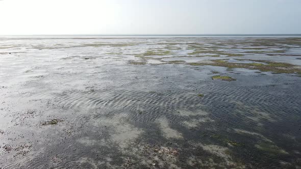 Aerial View of Low Tide in the Ocean Near the Coast of Zanzibar Tanzania Slow Motion