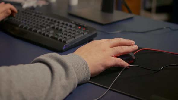 Closeup on Hands of Player Man Using Professional RGB Mouse