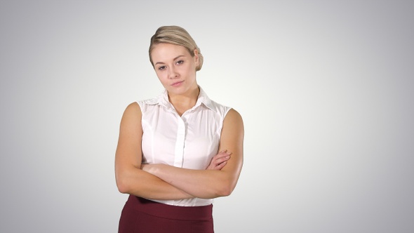 Beautiful confident young businesswoman standing with hands