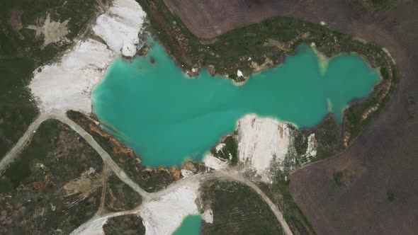 Aerial drone view Amazing industrial landscape, on Emerald lake in a flooded quarry