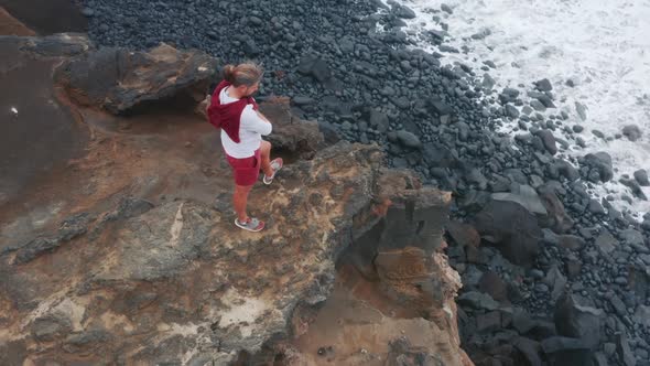 Male Tourist Standing on Volcanic Rock of Capelinhos Volcano Faial Island