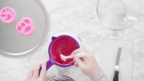 Flat lay. Flat lay. Melting red chocolate melts in the candy melting pot.