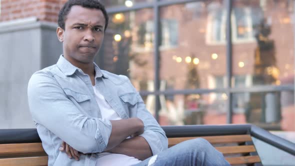 No Rejecting Young African Man Sitting on Bench