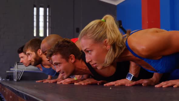 Group of people performing push-up exercise