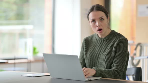 Shocked Woman At Work Looking at Camera, Wondering