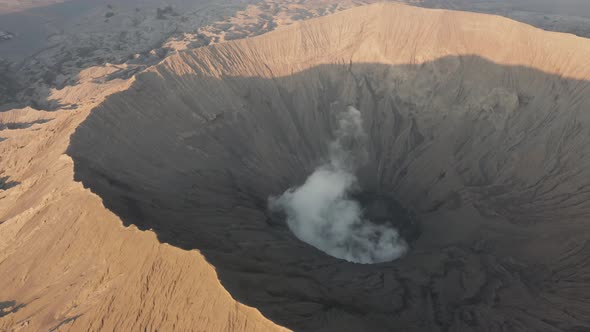 Aerial view of steam venting from an active volcano