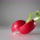 Cut radishes falling on water surface. Slow Motion. - VideoHive Item for Sale