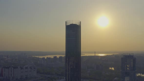 Aerial View of the Tall Modern Building Against the Sunset