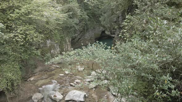 Aerial view of Martvili canyon. Blue water in fresh cold mountain river at sunny summer morning