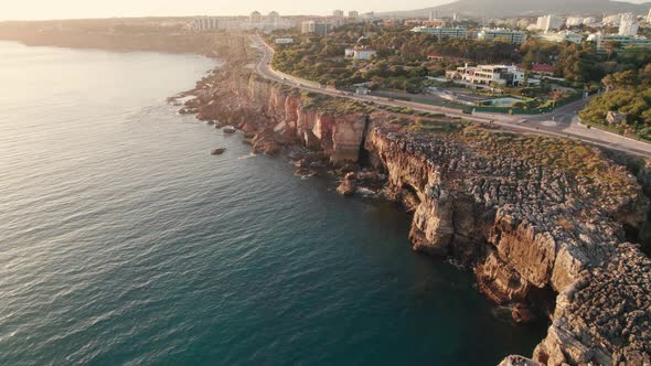 Aerial View of the Rocky Coast By the Sea in Cascais Town at Sunset Portugal