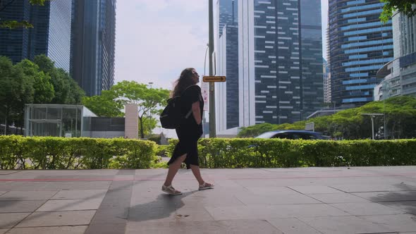 Summer in City Woman Is Walking Alone on Street