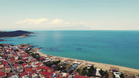 Aerial Drone View of the Famous Village and Long Sandy Beach of Sarti in South Sithonia Halkidiki