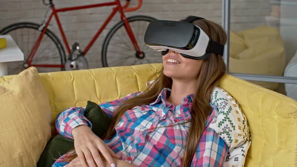 Young Woman Relaxing in VR Headset