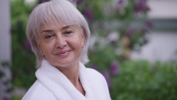 Closeup Portrait Happy Greyhaired Middle Aged Woman with Brown Eyes Smiling Looking at Camera