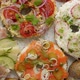 Bagel Sandwiches with Various Toppings Salmon Cottage Cheese Hummus Ham Radish and Fresh Herbs - VideoHive Item for Sale