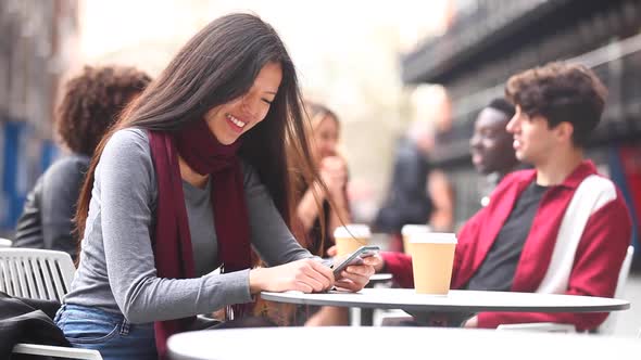 Authentic shot of people in a cafe, meeting, talking and using phones