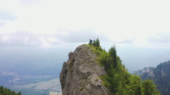 Hiker Above Huge Rock