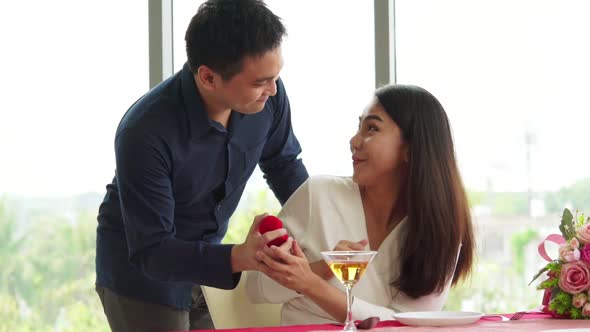 Happy Romantic Couple Eating Lunch at Restaurant