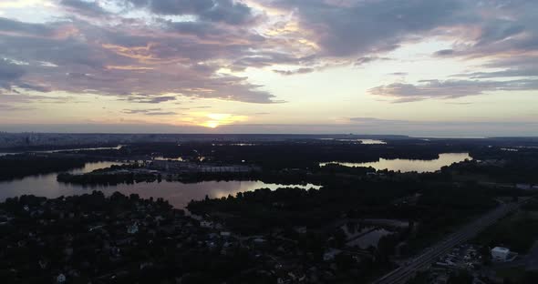 Aerial Beautiful View Of The Kyiv City And Dnieper River And At Sunset