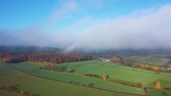 Aerial view of a German village surrounded by rapeseed fields, Marbach, Germany.