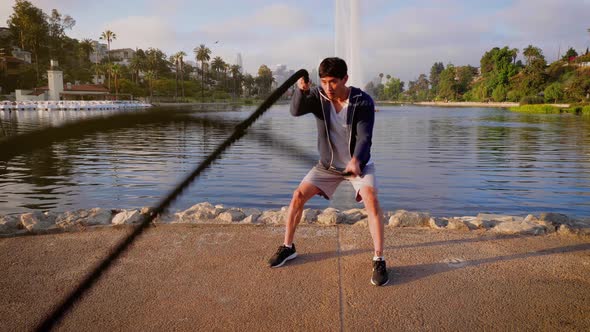 Young Asian man working out in a park in Los Angeles.