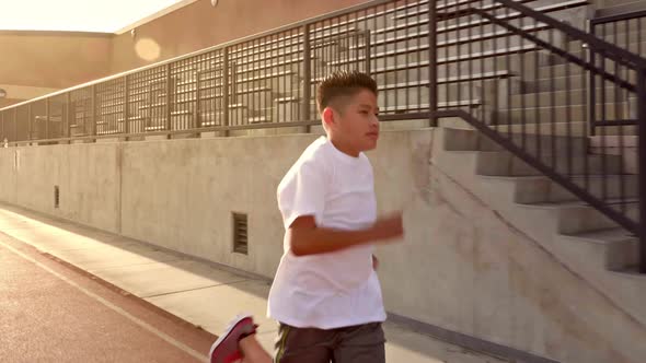 Boy Running On School Track