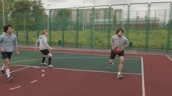 Four Guys Playing Streetball