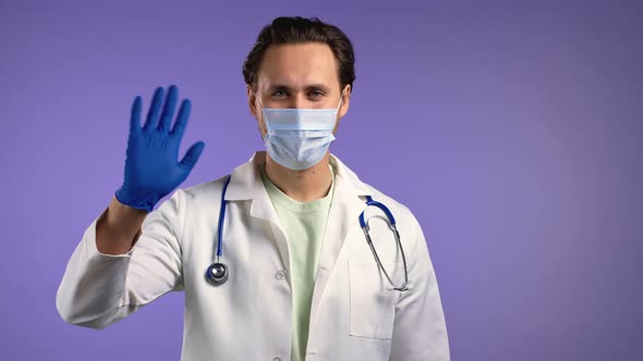 Friendly Doctor Man Waving Hand in Latex Gloves  Hello