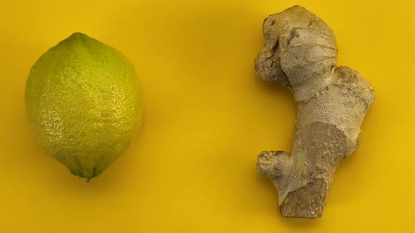 Lemons and ginger on yellow background, seamless loop stop motion animation 4k