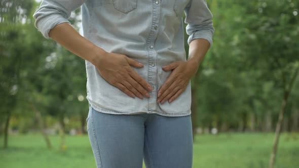 Female in Jeans Feeling Strong Lower Abdominal Pain, Menstruation, Health Care