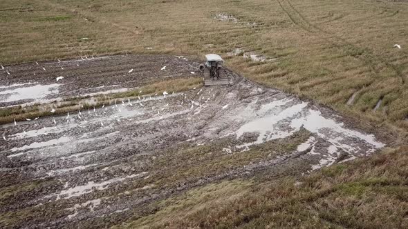 Aerial drone shot tractor plow 