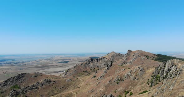 Rocky Landscape Of Macin Mountain Range With Blue Sky In the Background In Tulcea County, Dobrogea