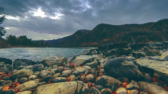 Time Lapse Shot of a River Near Mountain Forest. Huge Rocks and Fast Clouds Movenings. Horizontal