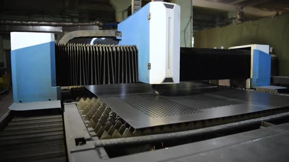 The Machine for Laser Cutting of Metal Makes the Cutting of a Metal Sheet.