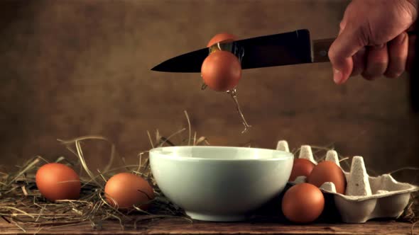 The Super Slow Motion of the Raw Egg is Broken Down By a Sharp Knife