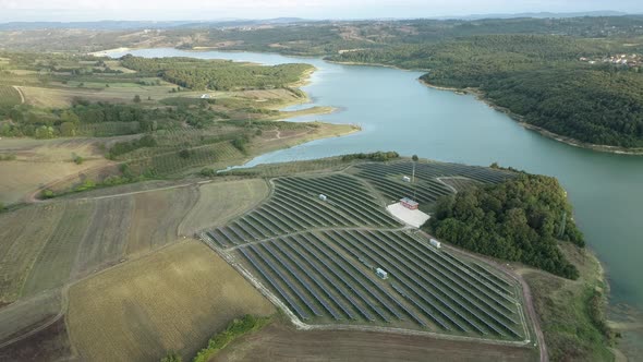 Lake View And Solar Panels On The Field