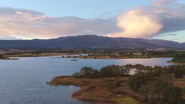 Lake drone aerial view of mountain panorama landscape at sunset in Marateca Dam in Castelo Branco, P