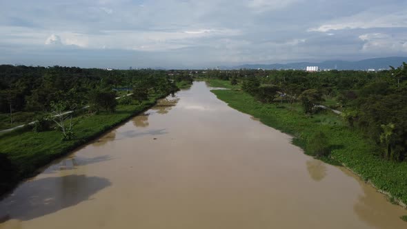 Cinematic move Sungai Perai river of green plantation