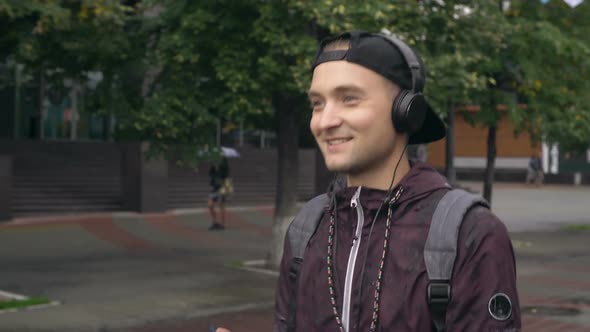 Man in Headphones Enjoying Music Outside