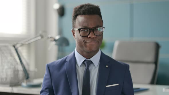 Portrait of African Businessman Shaking Head As No Sign Denial