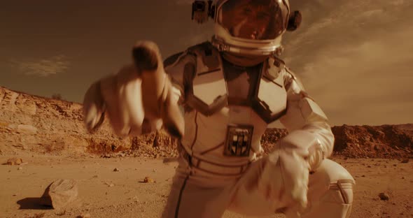 Male Astronaut Recording Video on Mars
